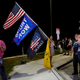 Supporters of former President Donald Trump shout as Kamrel Eppinger reports live for WPTV News Channel 5 near the home of former President Donald Trump at Mar-A-Lago on August 8, 2022, in Palm Beach, Florida.